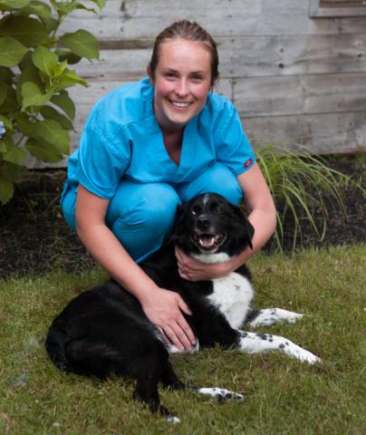 Dr. Catherine Lawton with her black and white dog Goose